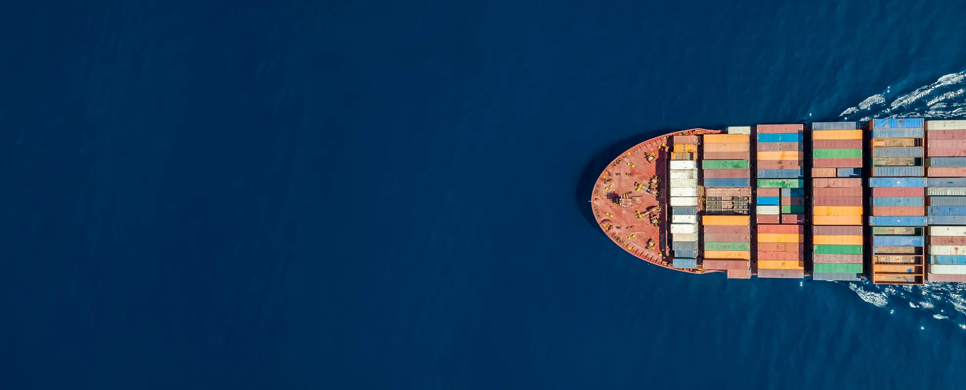 A beautiful container vessel at sea delivering CBAM goods under management via the Dubrink Platform.